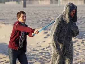 Elijah Wood takes a human for a walk on Venice beach.